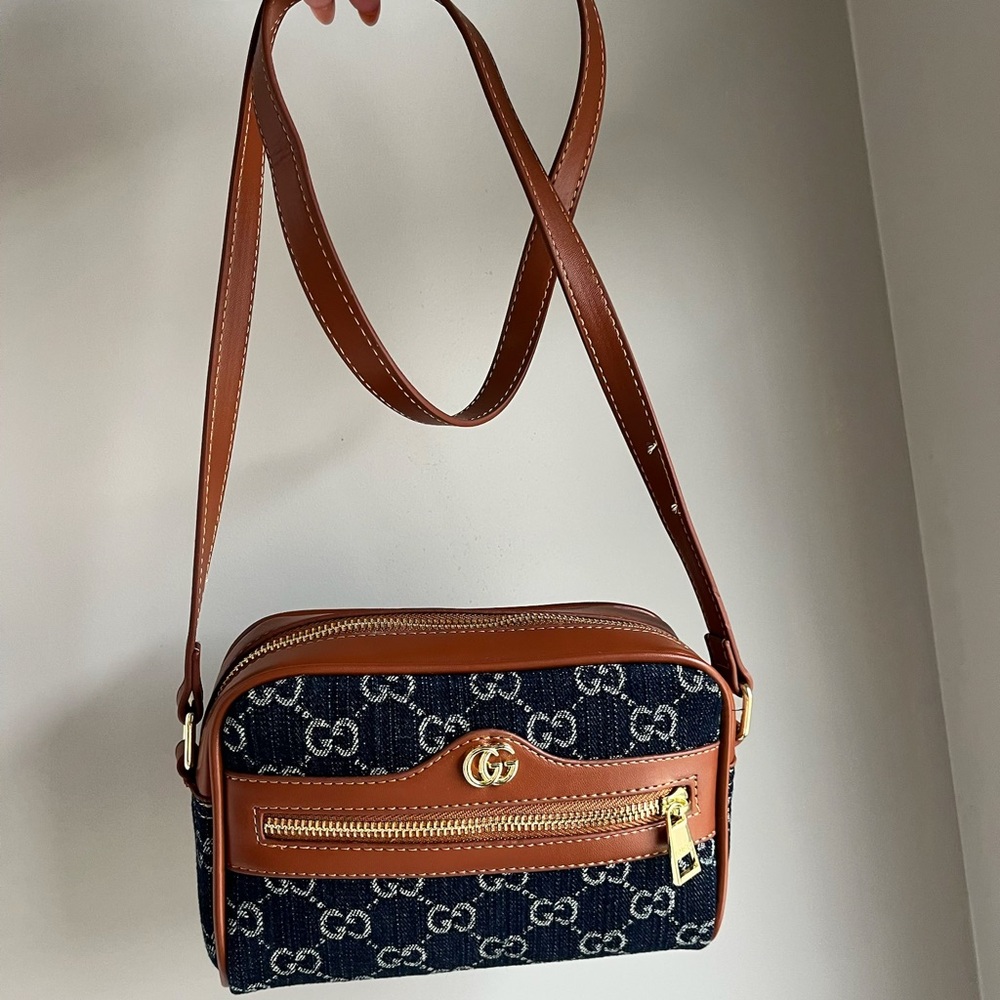 Source Unknown navy denim and brown leather crossbody bag with gold hardware